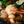 Load image into Gallery viewer, 牛もつ鍋の具材を箸で持ち上げた写真。もつとスープが絡み、周囲には野菜が見える。4~6人前のセット。
