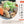 Load image into Gallery viewer, 国産牛ホルモン小腸300gの煮込み料理、具材には人参やこんにゃくが使われ、青ねぎがトッピングされた美味しそうな一皿。
