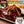 Load image into Gallery viewer, 牛たんの旨味が詰まった120gの牛たんハンバーグセット、オニオンソース付き。美味しそうなソースがかかったハンバーグのアップ画像。
