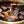 Load image into Gallery viewer, 炭火で焼かれた味付き焼肉の牛カルビ。赤身と脂身がバランスよく、食欲をそそる香ばしい焼き色が特徴。伊達のクラシックな秘伝のタレで味付けされており、甘さと旨味が引き立つ一品。
